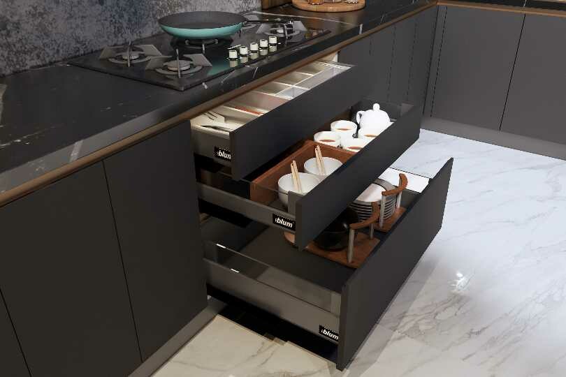 Kutchina L-shaped kitchen with dark grey and marble countertop