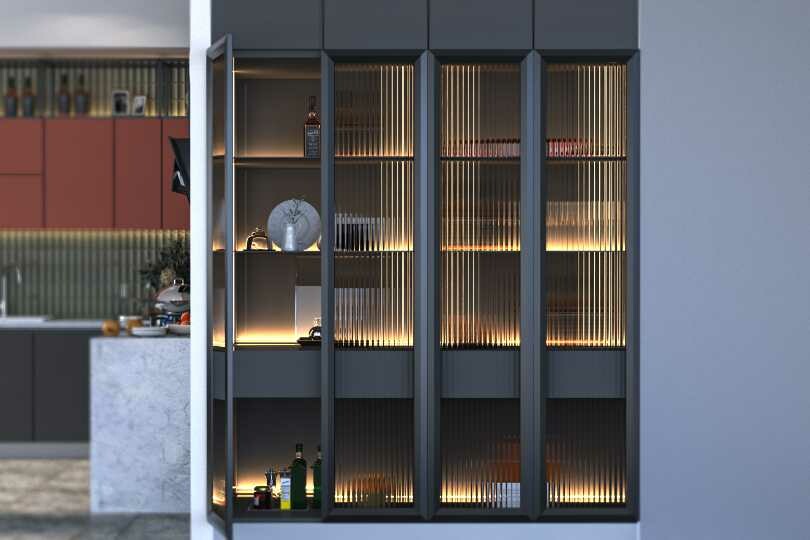 Kutchina L-shaped kitchen with light coral and fluted glass tall units